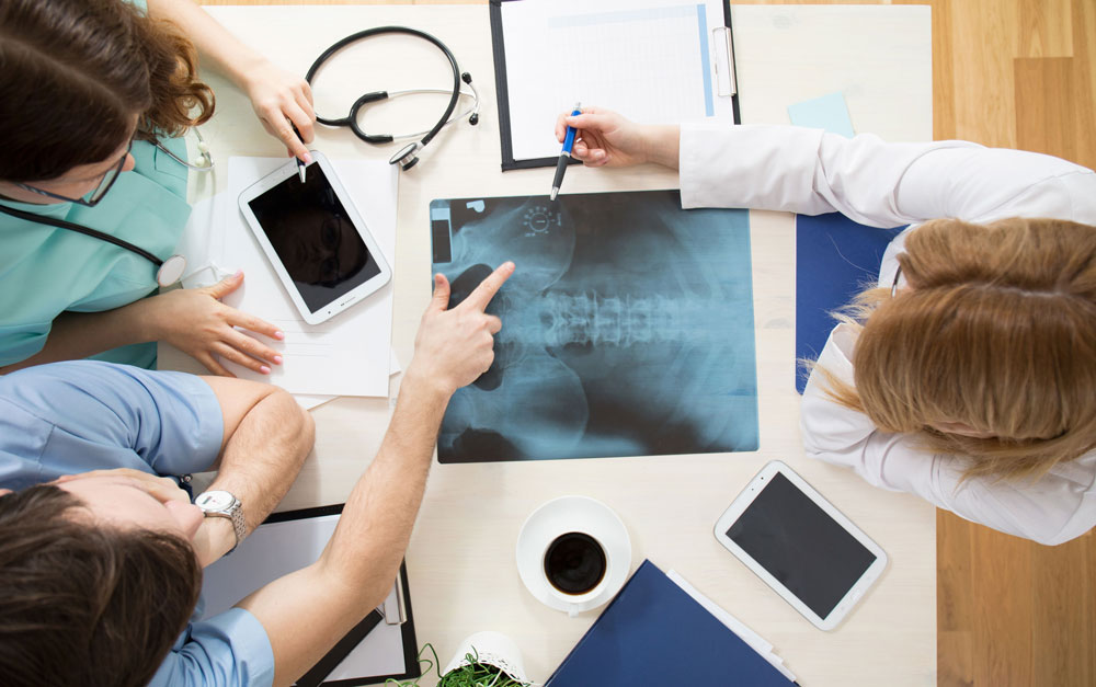 doctors review back x-ray