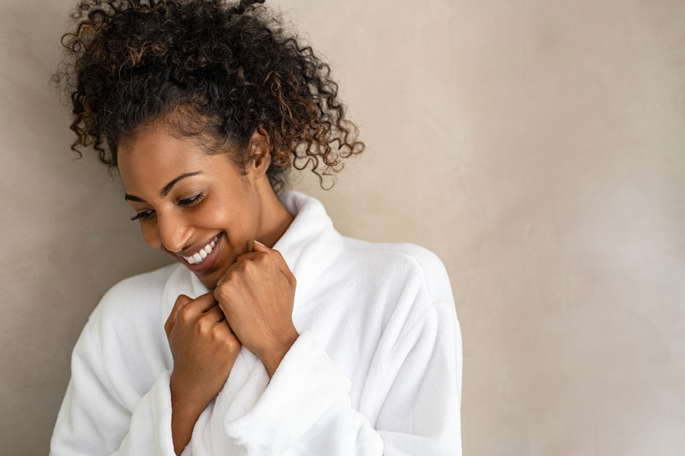 woman smiling in bath robe