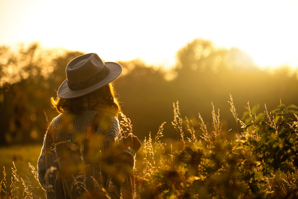 woman faces morning sunlight