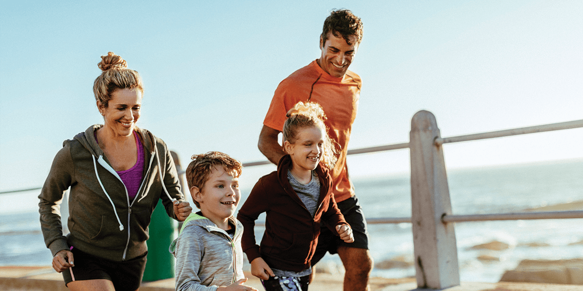 Family running at beach